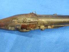 Antique black powder rifle.  Unknown maker or caliber.  Not safe to shoot.  Non-operable hammer and 