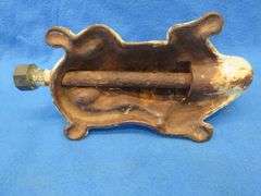 Antique cast iron lawn sprinkler in the form of an alligator.  Unknown maker.