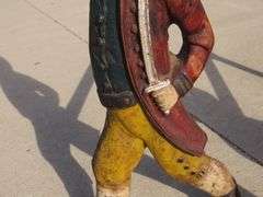 Two matching Hessian soldier antique cast iron andirons