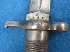 Swedish Mauser bayonet, metal sheath, and leather holder