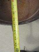 Vintage cast iron kettle 20" wide x 10 1/2" deep, has all three feet and the handle