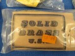 Eight belt buckles from fraternal organizations and one from Smith and Wesson. Some are marked as br