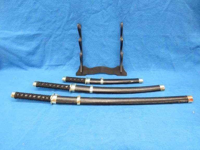 Three-sword set with scabbards and display stand