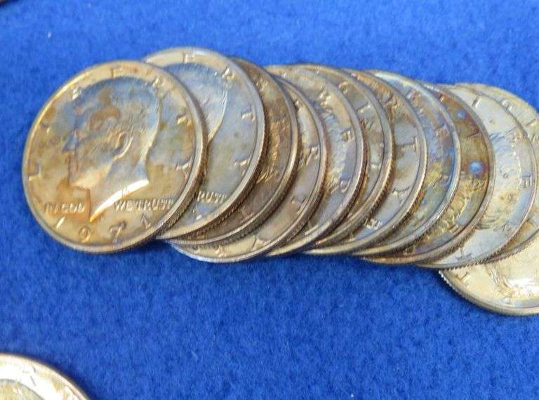 30 clad Kennedy halves and three Eisenhower dollars