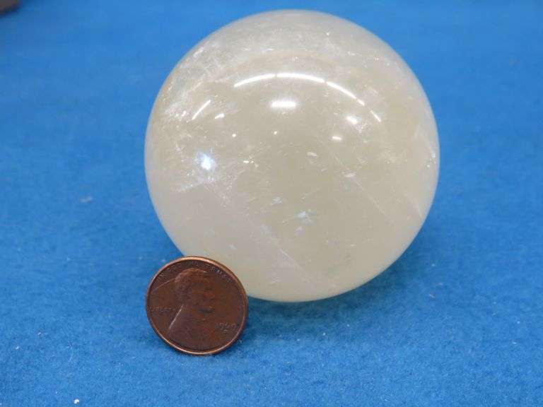 Honey Calcite Sphere and a Satin Spar Cube.  Total weight 1.15 lb.
