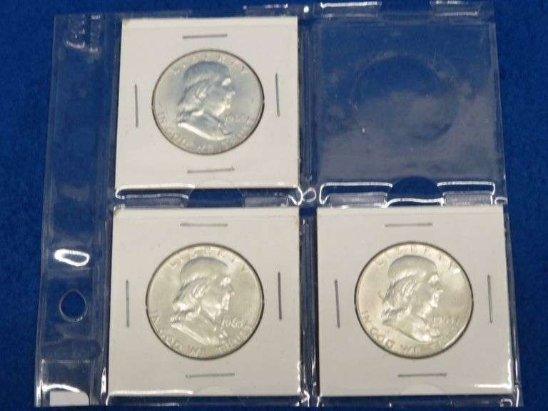 Three Franklin half-dollars