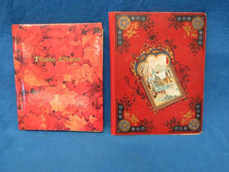 Two scrapbooks filled with postcards, greeting cards. tobacco cards, and more