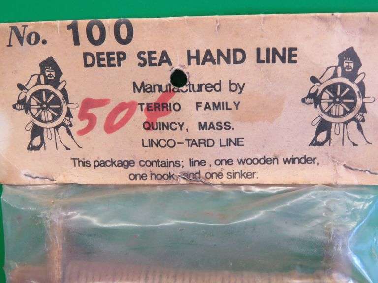 Hand carved wooden bobber and a vintage package of Deep Sea Hand Line