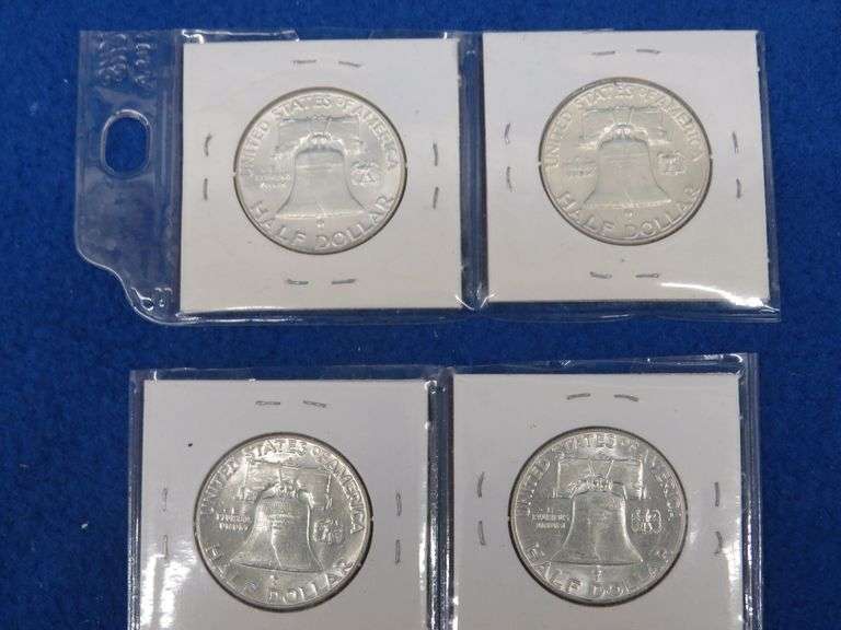 Four Franklin half-dollars