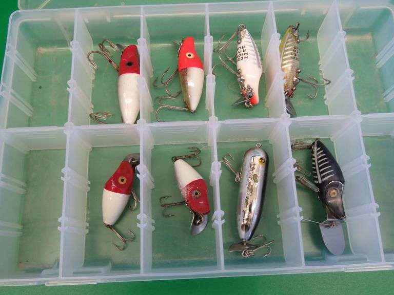 Eight Heddon Baits and a bait box, including River Runts, Midget Digits, and a Torpedo-style bait fr