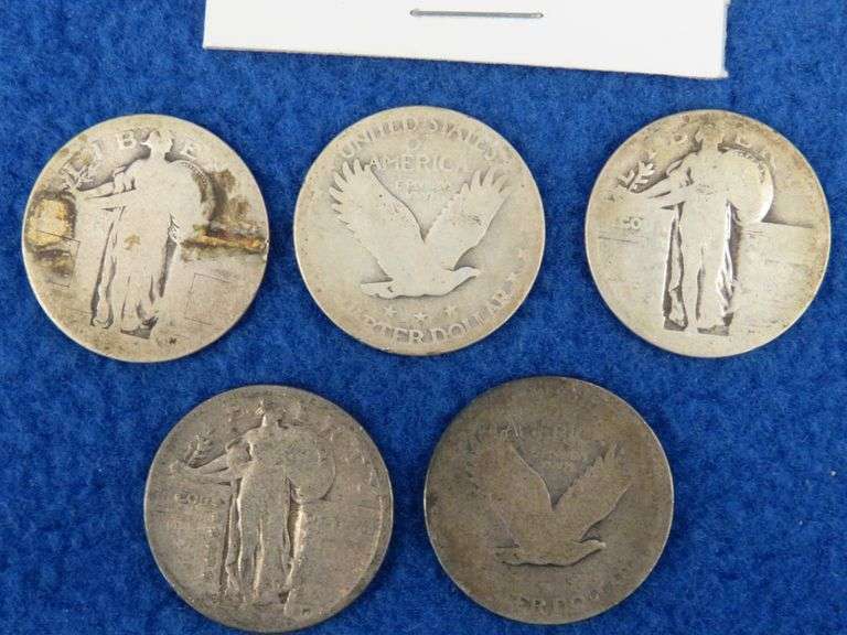 Five Standing Liberty Quarters and a Franklin half-dollar
