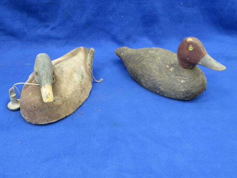 Two vintage duck decoys, one cork and one wooden with glass eyes