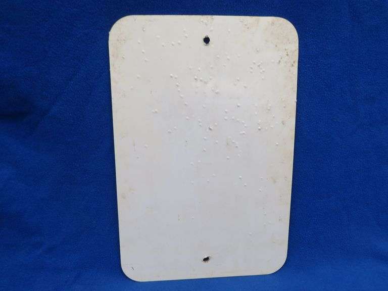 Plastic like No Hunting or Shooting sign that has been hunted