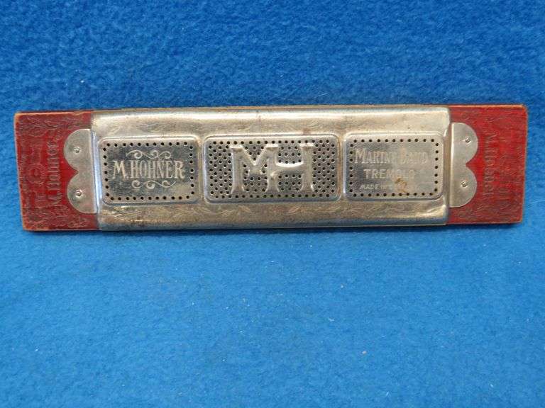 Hohner 40-hole double-sided tremolo harmonica.  Sounds great.