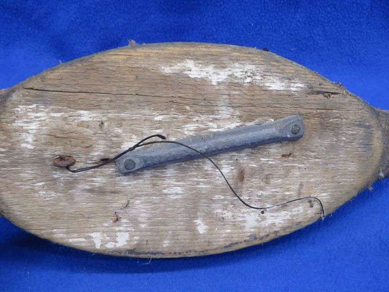 Two vintage duck decoys, one cork and one wooden with glass eyes