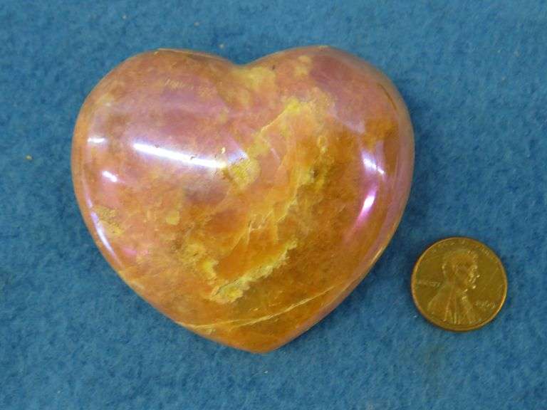 Three heart shapes stones.  Flourite, Aura Quartz, and a Peach Moonstone.  Total weight of 1.11 lb.