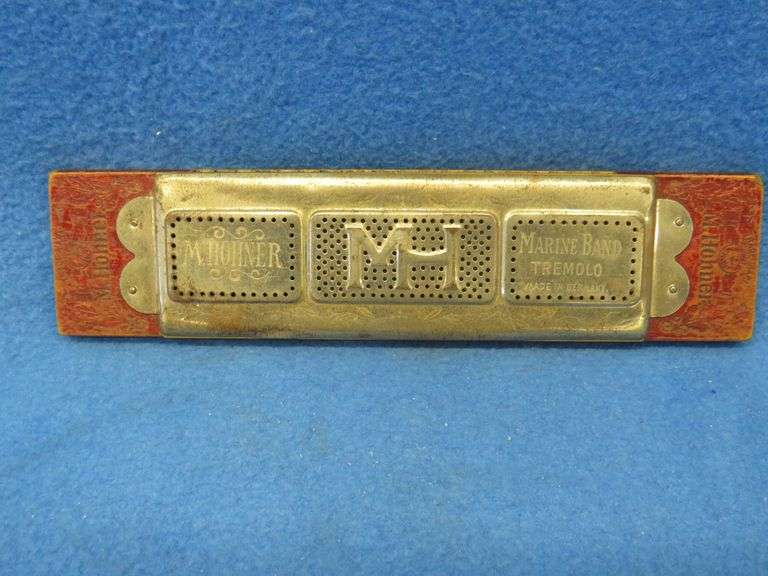 Hohner 40-hole double-sided tremolo harmonica.  Sounds great.