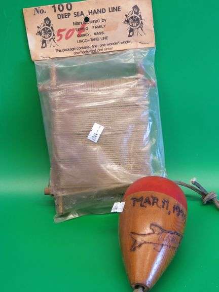 Hand carved wooden bobber and a vintage package of Deep Sea Hand Line