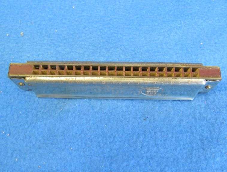 Johann Schrunk Castle Brand tremolo key of C harmonica with 20 holes.