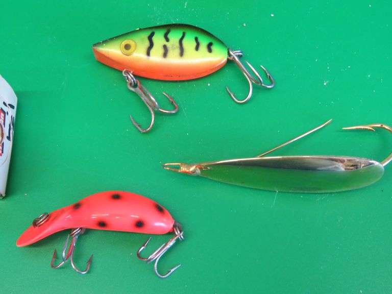 Three vintage baits all in boxes. Heddon Tiny Tad, Storm Lil Tex, and Johnson's Gold Minnow