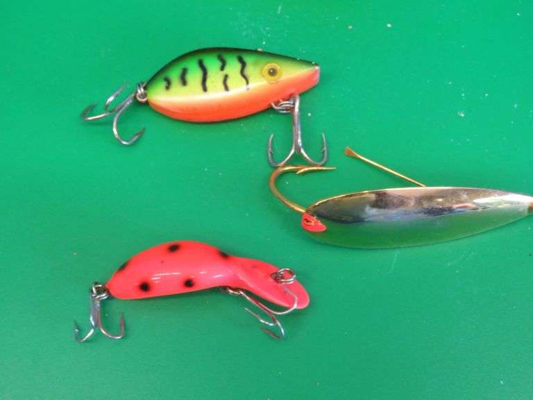 Three vintage baits all in boxes. Heddon Tiny Tad, Storm Lil Tex, and Johnson's Gold Minnow
