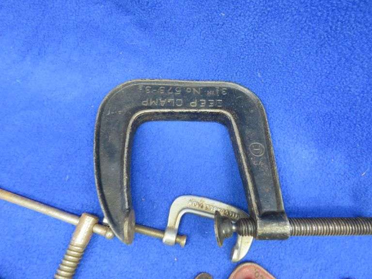 Different sized C-clamps and a rubber mallet