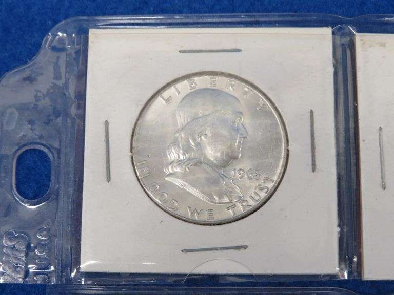 Four Franklin half-dollars