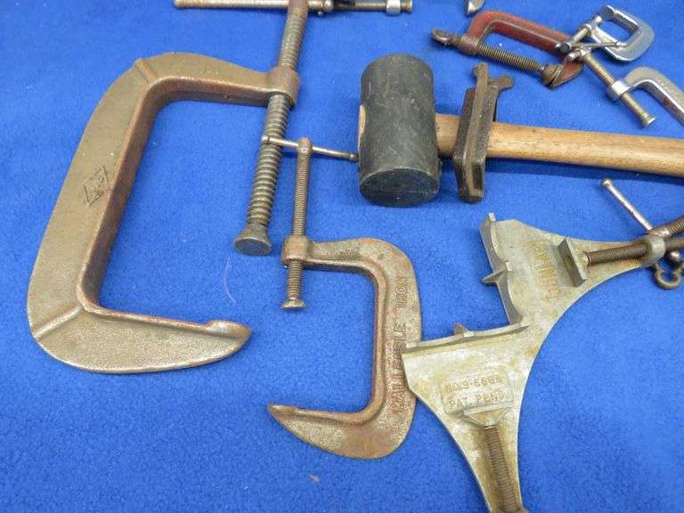 Different sized C-clamps and a rubber mallet