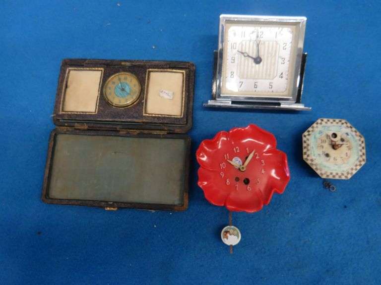 Four clocks for parts or repair.[ The large rectangular clock and the small round brass clock are Lu