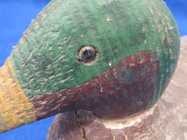 Vintage wooden duck decoy with glass eyes