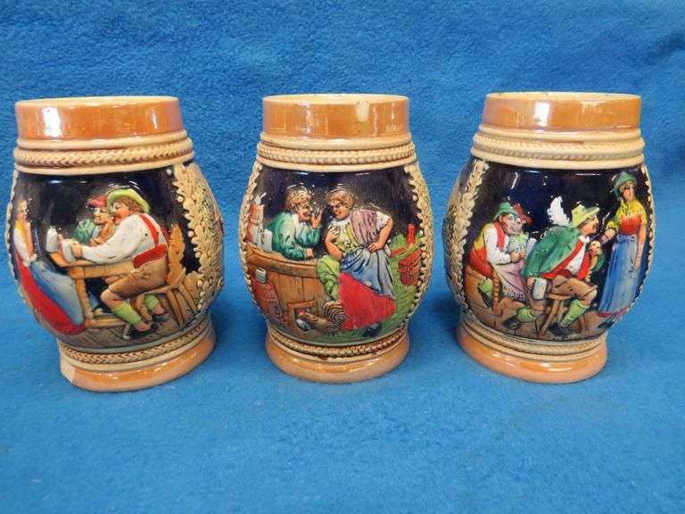 Three beer mugs and one stein