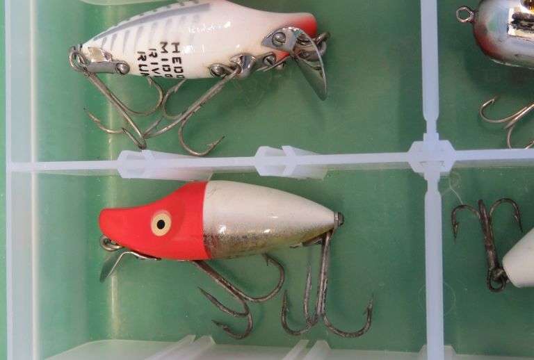 Eight Heddon Baits and a bait box, including River Runts, Midget Digits, and a Torpedo-style bait fr
