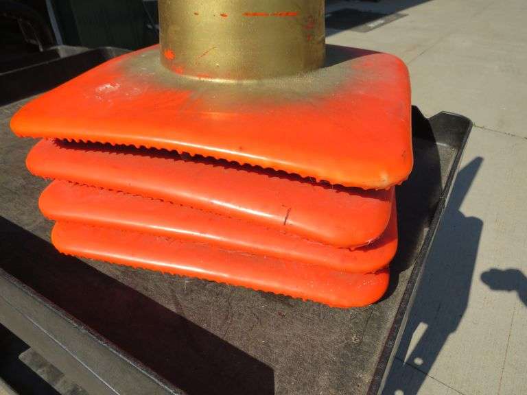Never used motorcycle trunk and four traffic cones
