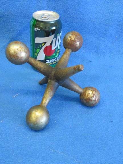 Large decorative chrome-plated cast iron toy jack.
