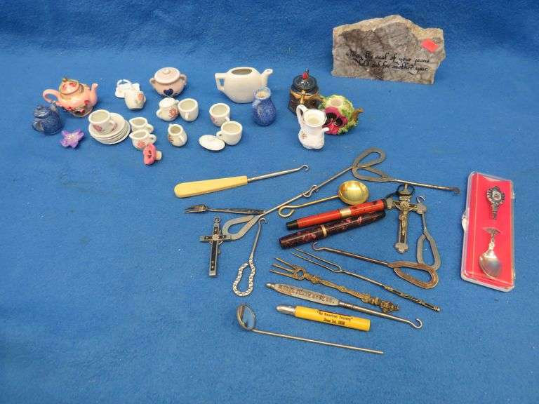 Collectible smalls including boot hooks, a child's play tea set, crucifixes, and more