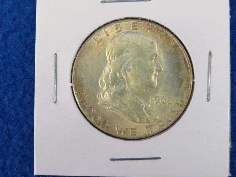Five Standing Liberty Quarters and a Franklin half-dollar