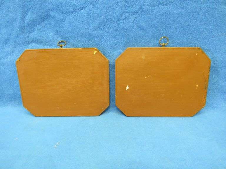 Two wall plaques depicting antique cars