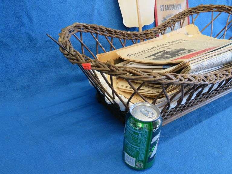 Antique wicker basket with an old Gluek's advertising fan, and Collector's Weekly and Antique monthl