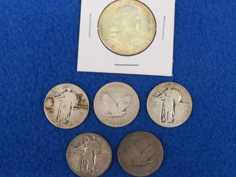 Five Standing Liberty Quarters and a Franklin half-dollar
