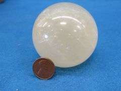 Honey Calcite Sphere and a Satin Spar Cube.  Total weight 1.15 lb.