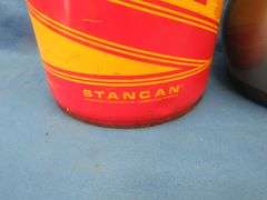 Vintage snowmobile Stancan 6.5 gallon steel gas can and a 6 7/8-7" Bell helmet.