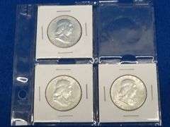 Three Franklin half-dollars