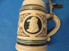 Three beer mugs and one stein