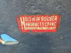 Completed cross stitch and a vintage rubber "Old Ironsides" door stop.