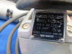 Vintage sabre saw and sander, battery charger, and more