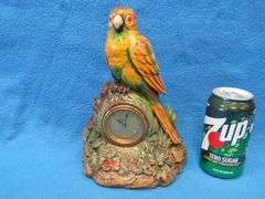 Lux wood and plaster painted parrot clock.  Movement works but hands don't move.
