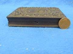 Civil-War-era tintype in a military-themed case.  Very good condition.  Hand-colored photo of a sold