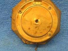 Four clocks for parts or repair.[ The large rectangular clock and the small round brass clock are Lu