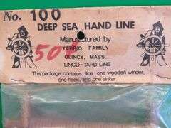 Hand carved wooden bobber and a vintage package of Deep Sea Hand Line