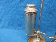 Antique unmarked oil lamp with chimney.  Missing the chimney holder.